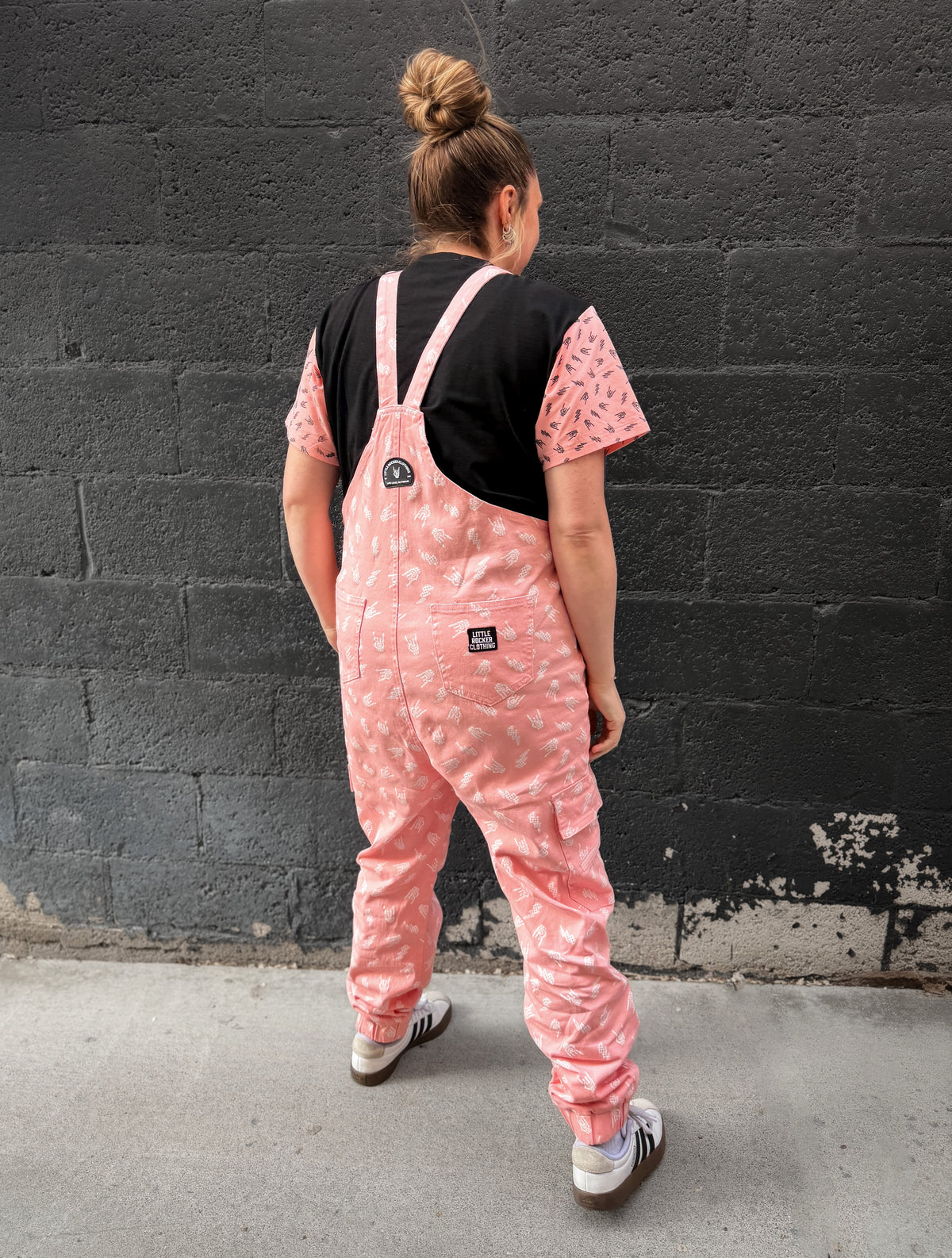 pink bolted bones overalls for adults styled as edgy outfit and rock inspired clothing from Little Rocker Clothing