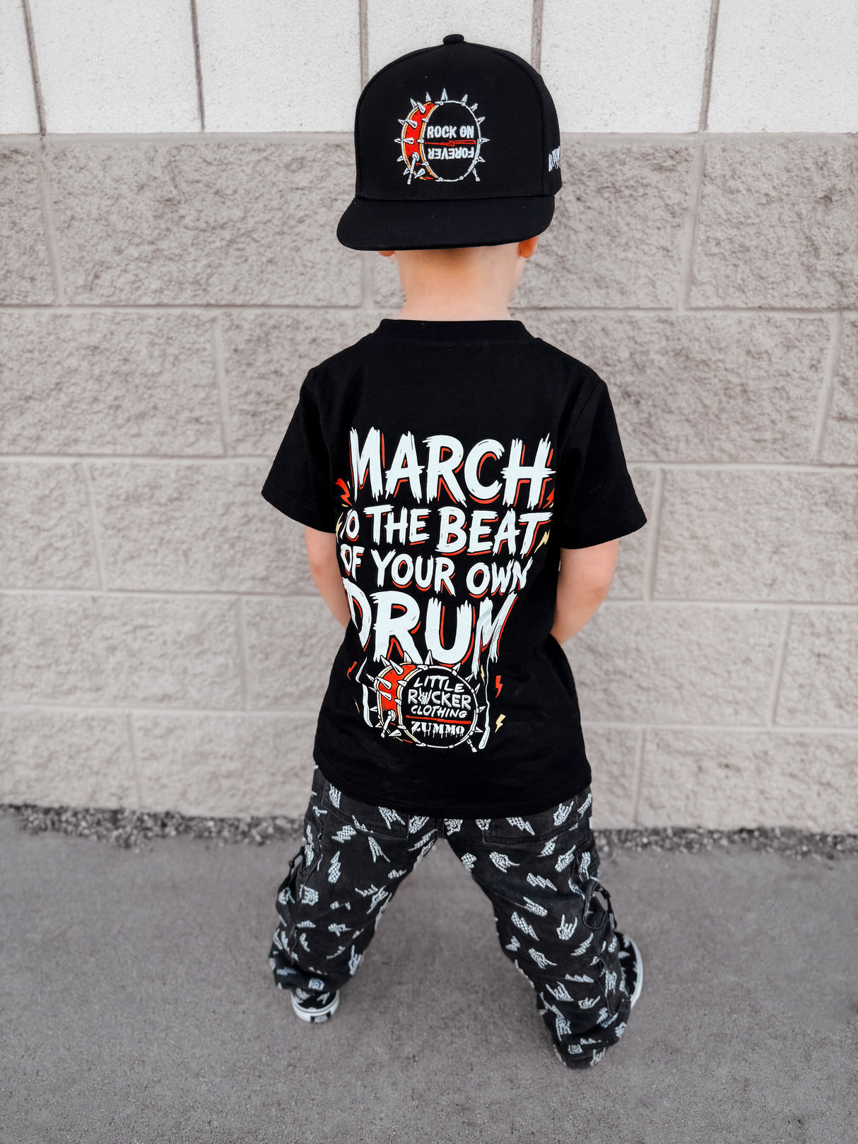 Frank Zummo Collab shirt featuring march to the beat of your own drum, rocker inspired graphic tee with soft comfortable fit, oversized style available in kids infant onesie up to