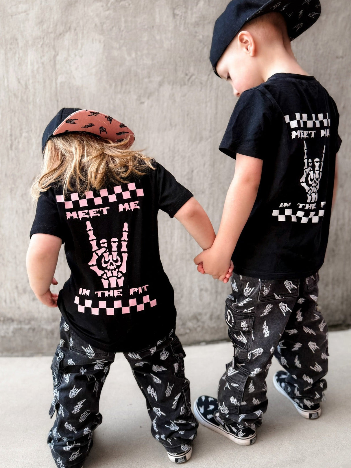 matching kids punk rock outfits featuring black graphic tees meet me in the pit design with alternative kids clothing and streetwear pants