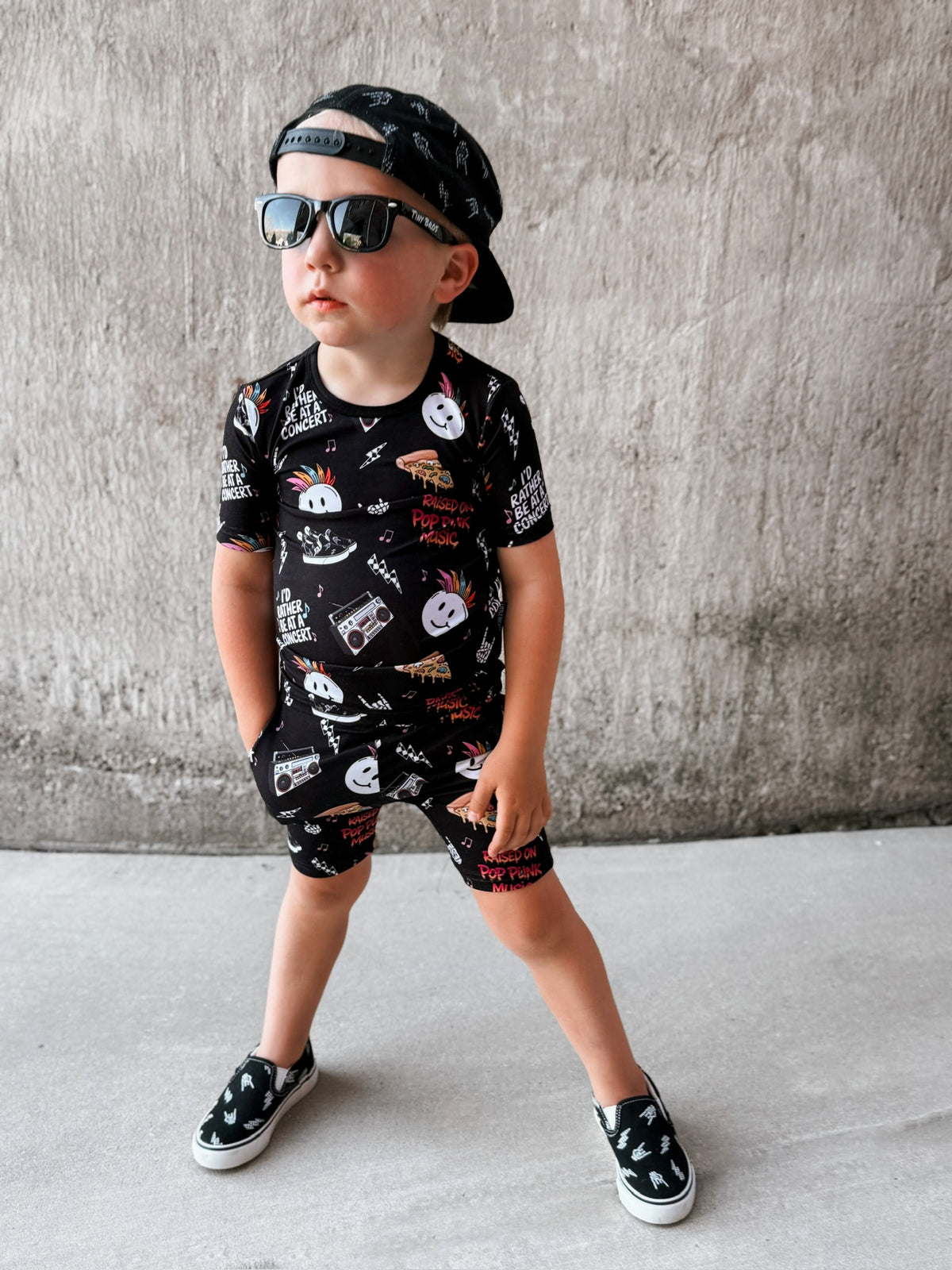 boy wearing pop punk collage pattern 2 piece short bamboo pajamas for kids