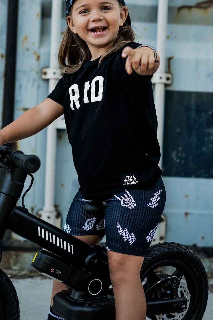 black kids graphic t-shirt with rad text and bolted bone pattern biker shorts, little rocker clothing rock style outfit for toddlers and kids