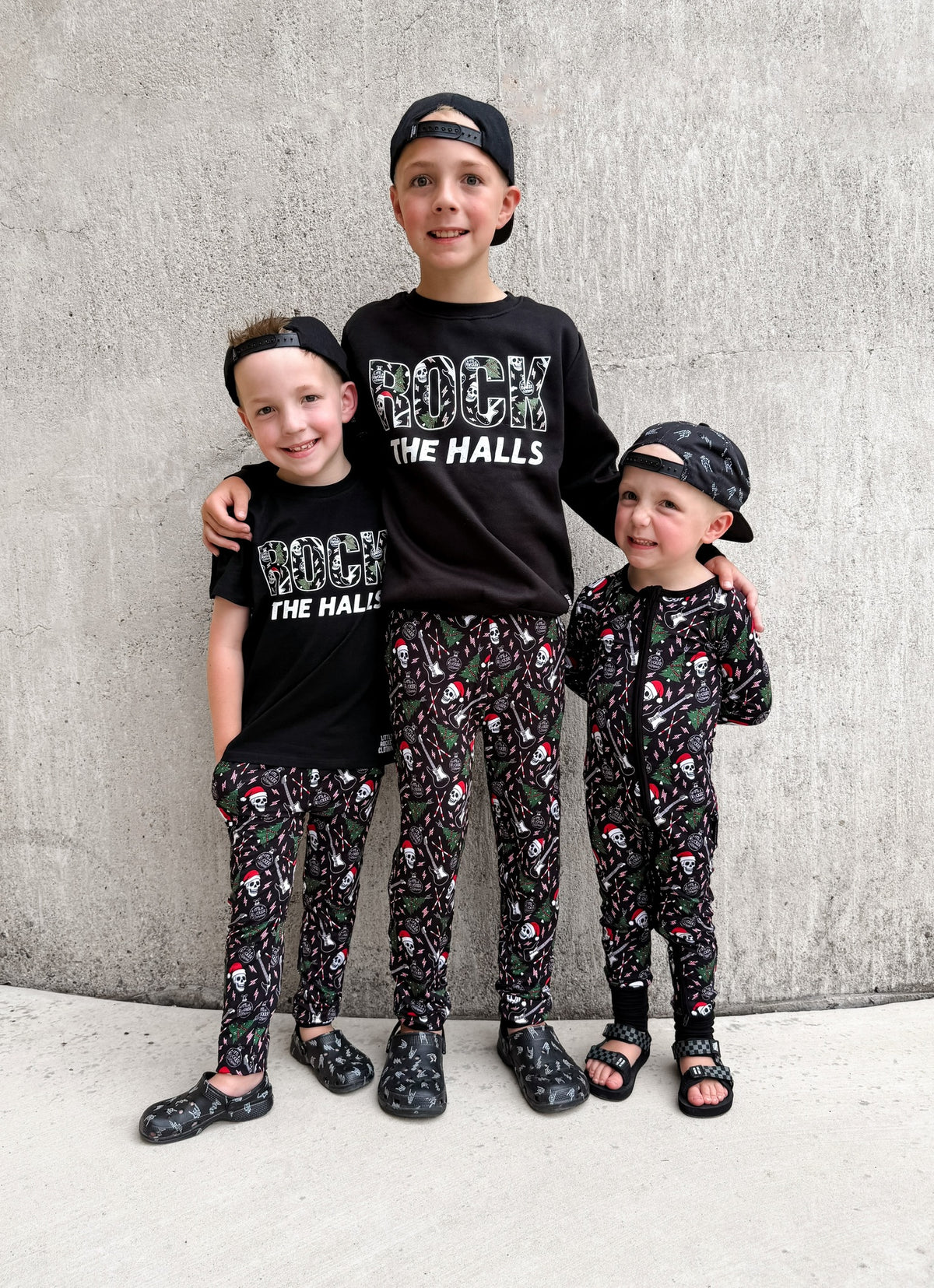 2 boys wearing rock the halls christmas theme black tshirt from little rocker clothing