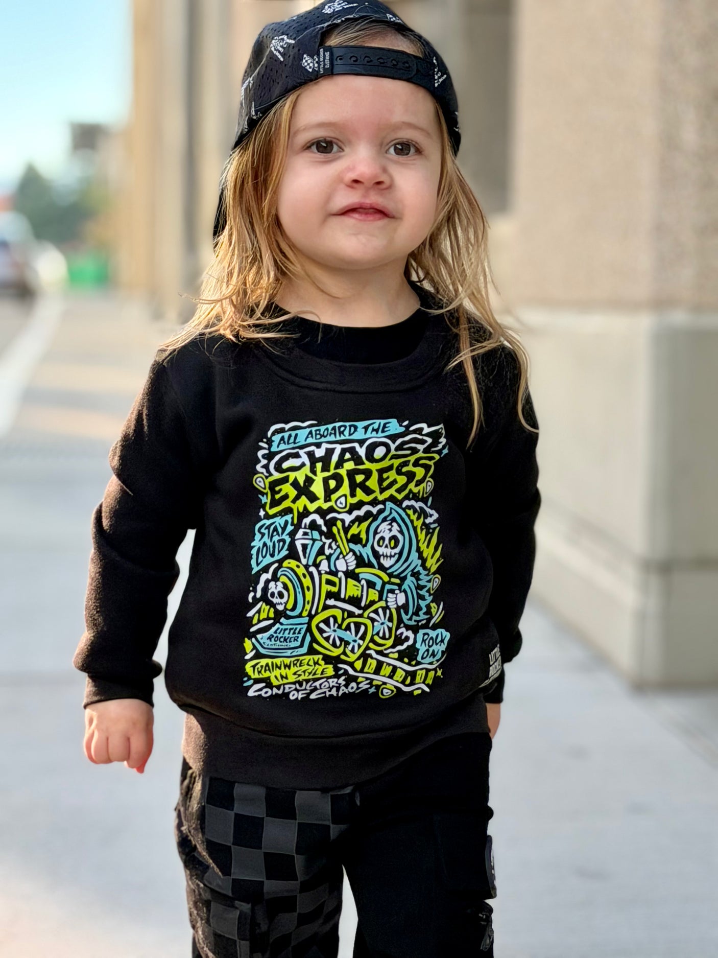 Toddler wearing the Kids black Scene Sampler crew neck sweatshirt featuring pop punk, emo, and alt rock graphic with train illustration, rocker style kids apparel