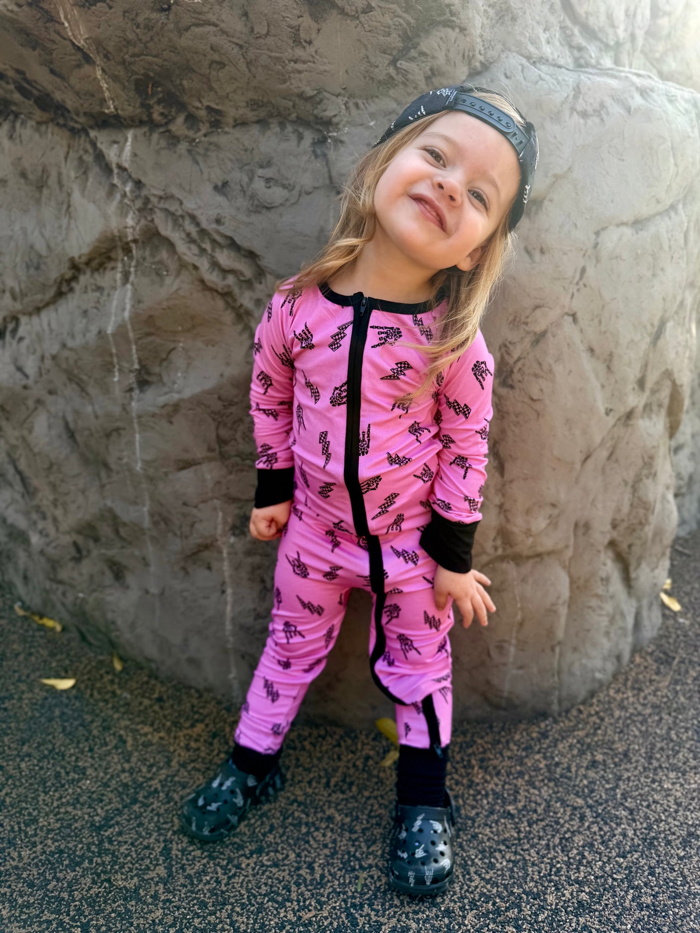 Pink bamboo pajama set with long sleeves and full length pants, featuring an edgy rock inspired print, made from ultra soft breathable bamboo fabric with a stretchy comfortable fit for babies and kids up to 3T