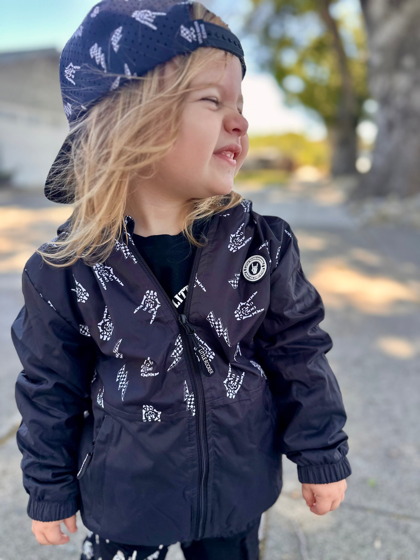 Kids bolted bones black windbreaker jacket with all over graphic print, lightweight rocker style outerwear for kids with zip front and hood