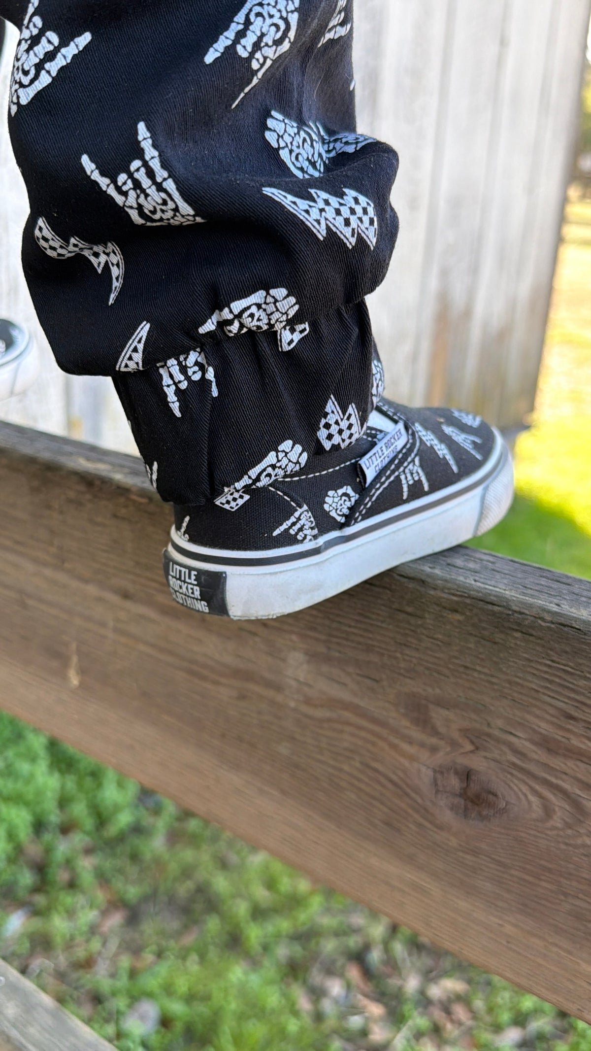 kids wearing bolted bones canvas slip on shoes black and white rocker sneakers outfit