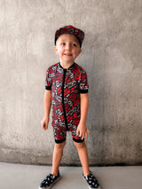 Black and Red baby shortie pajamas featuring an edgy rock-inspired print, made from ultra-soft breathable fabric, designed for babies and toddlers up to size 5T with a comfy stretchy fit and short sleeves and short pant legs for warmer nights