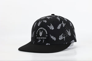 black snapback hat with allover bolted bones lightning bolt and rock hand print little rocker clothing patch flat brim adjustable cap for kids and adults