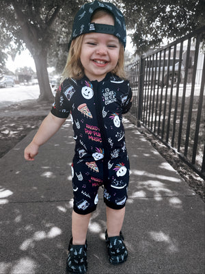 toddler wearing pop punk collage pattern short sleeve zip up bamboo pajamas for kids