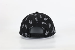 back side of black snapback hat with allover bolted bones lightning bolt and rock hand print little rocker clothing patch flat brim adjustable cap for kids and adults