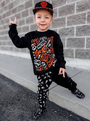 Boy wearing the scene sampler crew neck sweatshirt for kids and adults with pop punk alt rock metal emo graphic design, black and red music inspired sweatshirt little rocker clothing
