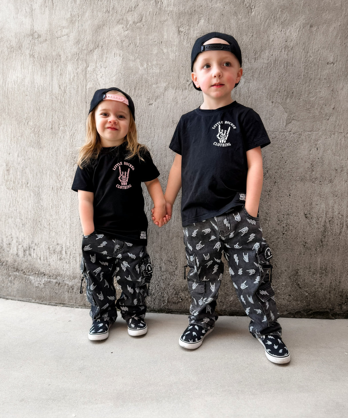 matching kids punk rock outfits featuring black graphic tees meet me in the pit design with alternative kids clothing and streetwear pants