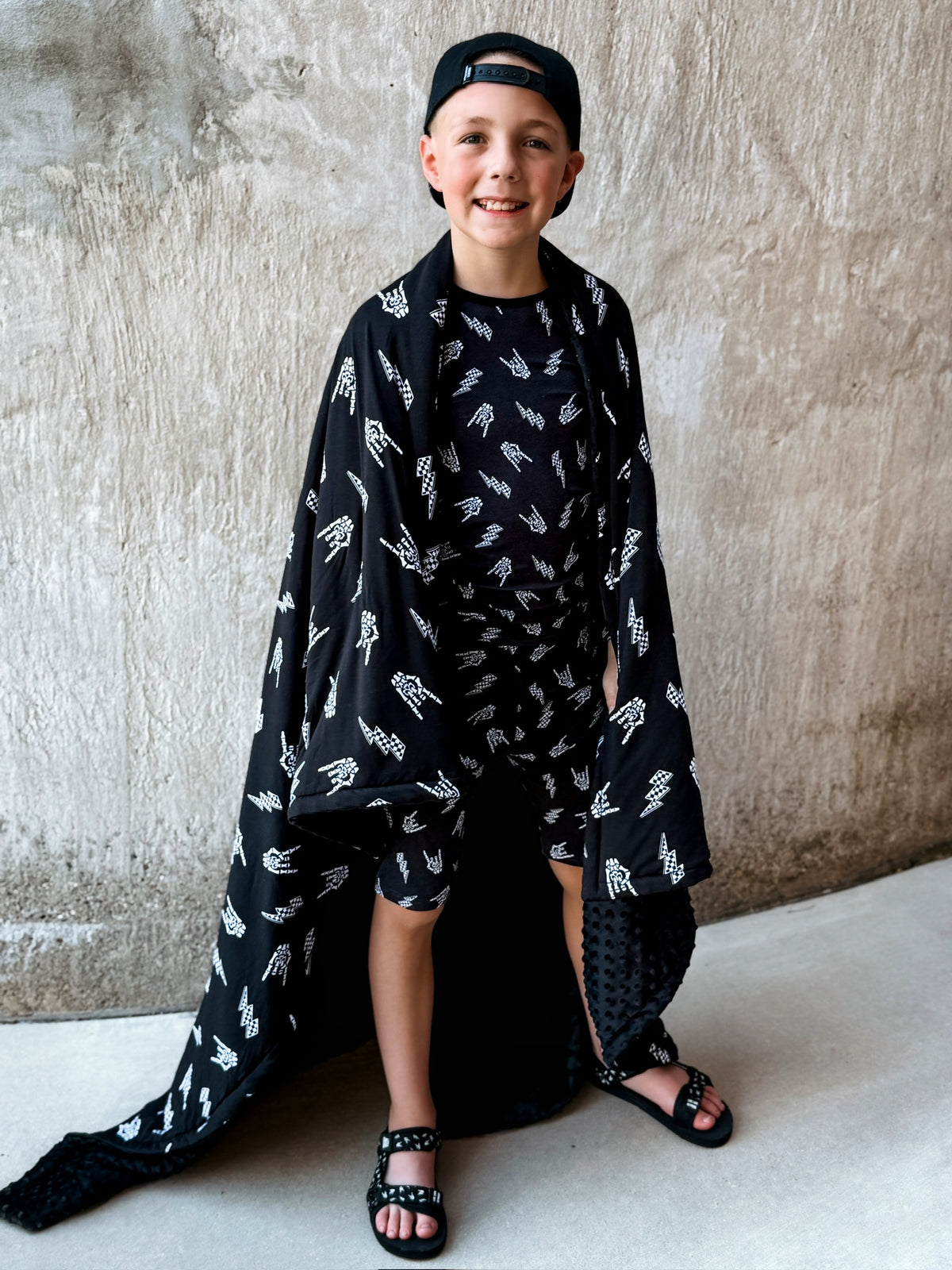 preteen boy using bolted bones pattern minky blanket