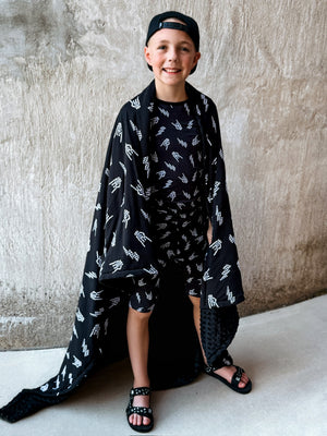 preteen boy using bolted bones pattern minky blanket