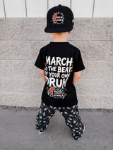 Frank Zummo Collab shirt featuring march to the beat of your own drum, rocker inspired graphic tee with soft comfortable fit, oversized style available in kids infant onesie up to 