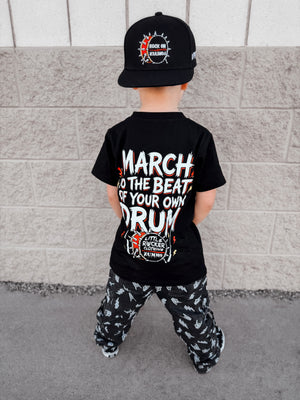 Frank Zummo Collab shirt featuring march to the beat of your own drum, rocker inspired graphic tee with soft comfortable fit, oversized style available in kids infant onesie up to 
