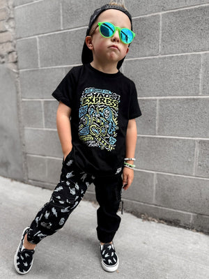 Edgy kid wearing the Kids black chaos express t-shirt featuring rock inspired graphic with train illustration on a graphic tee, rocker style kids apparel
