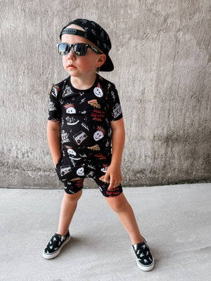 boy wearing pop punk collage pattern 2 piece short bamboo pajamas for kids