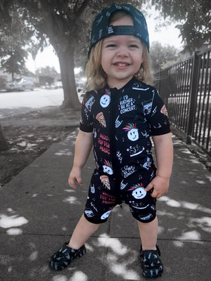 toddler wearing pop punk collage pattern short sleeve zip up bamboo pajamas for kids