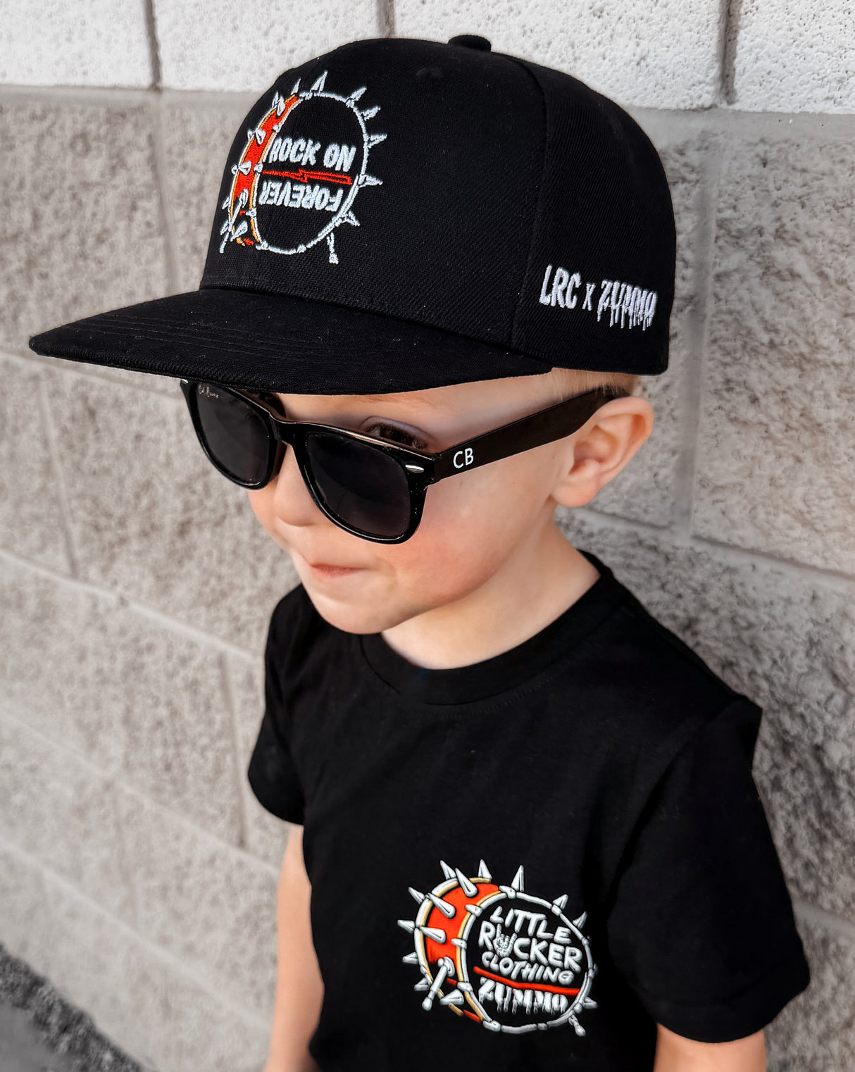 Frank Zummo collaboration with Little Rocker Clothing snapback hat with drum graphic and rock on forever phrase, edgy rock style kids hat with adjustable fit, music inspired youth apparel accessory