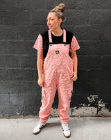 adult wearing pink bolted bones overalls for matching family outfits and alternative style from Little Rocker Clothing