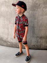 Black and Red baby pajamas featuring an edgy rock-inspired print, made from ultra-soft breathable fabric, designed for babies and toddlers up to size 5T with a comfy stretchy fit and short sleeves and short pant legs for warmer nights