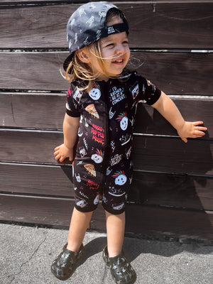 toddler wearing pop punk collage pattern short sleeve zip up bamboo pajamas for kids