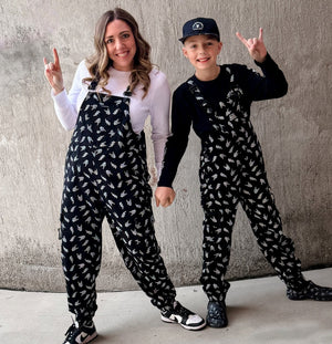 black bolted bones overalls for adults styled as edgy outfits and rock inspired clothing from Little Rocker Clothing