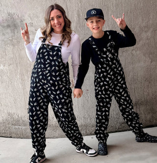black bolted bones overalls for adults styled as edgy outfits and rock inspired clothing from Little Rocker Clothing