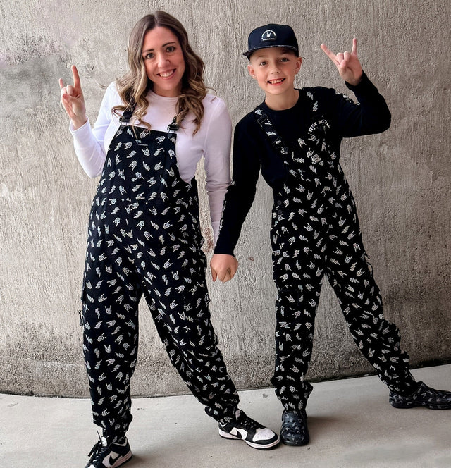 black bolted bones overalls for adults styled as edgy outfits and rock inspired clothing from Little Rocker Clothing