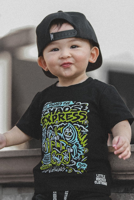 Infant wearing the Kids black chaos express t-shirt featuring rock inspired graphic with train illustration on a graphic tee, rocker style kids apparel