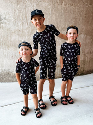 3 boys wearing bolted bones 2 piece bamboo pajamas for kids