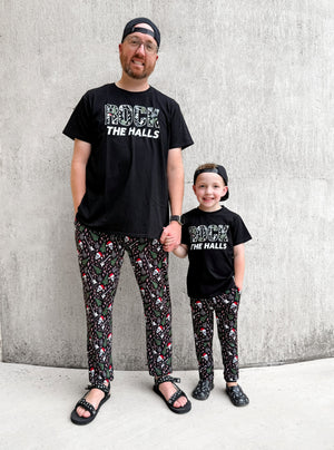 father and son wearing rock the halls christmas theme black tshirt from little rocker clothing