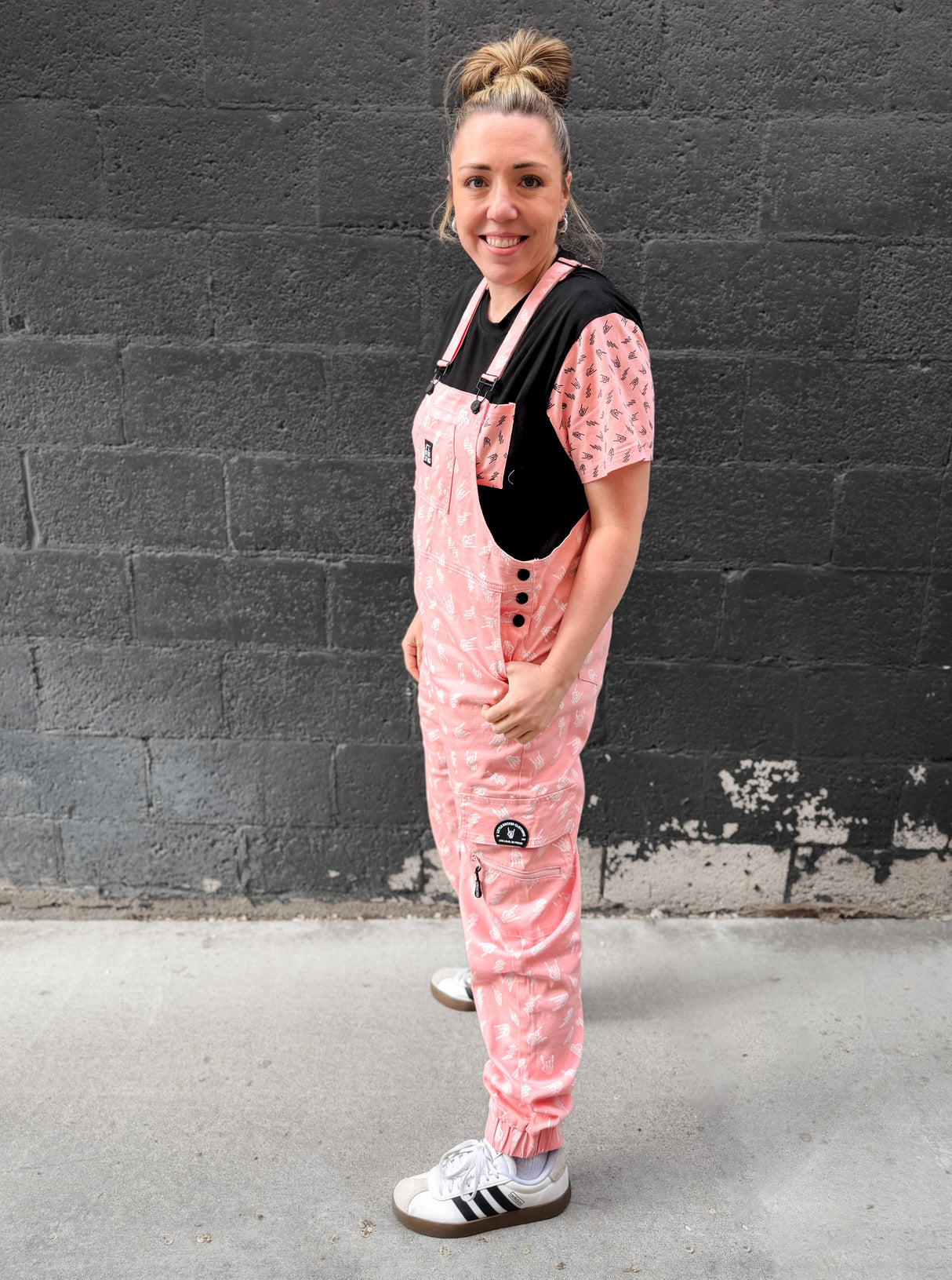 woman wearing pink bolted bones overalls styled as edgy outfit from Little Rocker Clothing alternative fashion