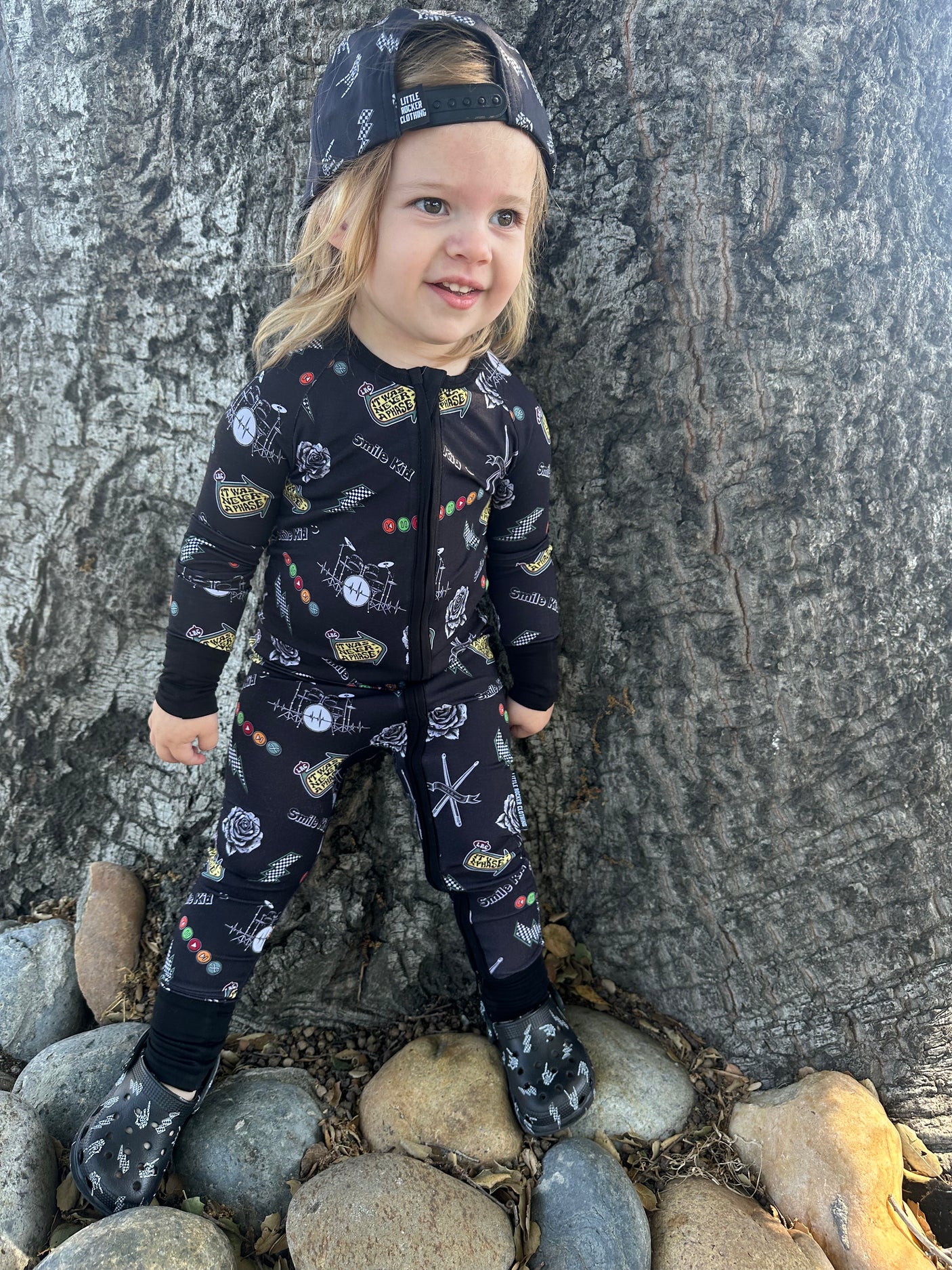 toddler girl wearing emo nights pattern long sleeve zip up pajamas for kids