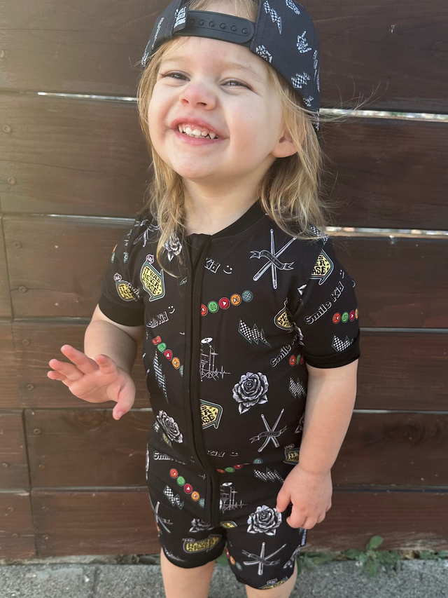 toddler girl wearing emo nights pattern short sleeve zip up pajamas for kids