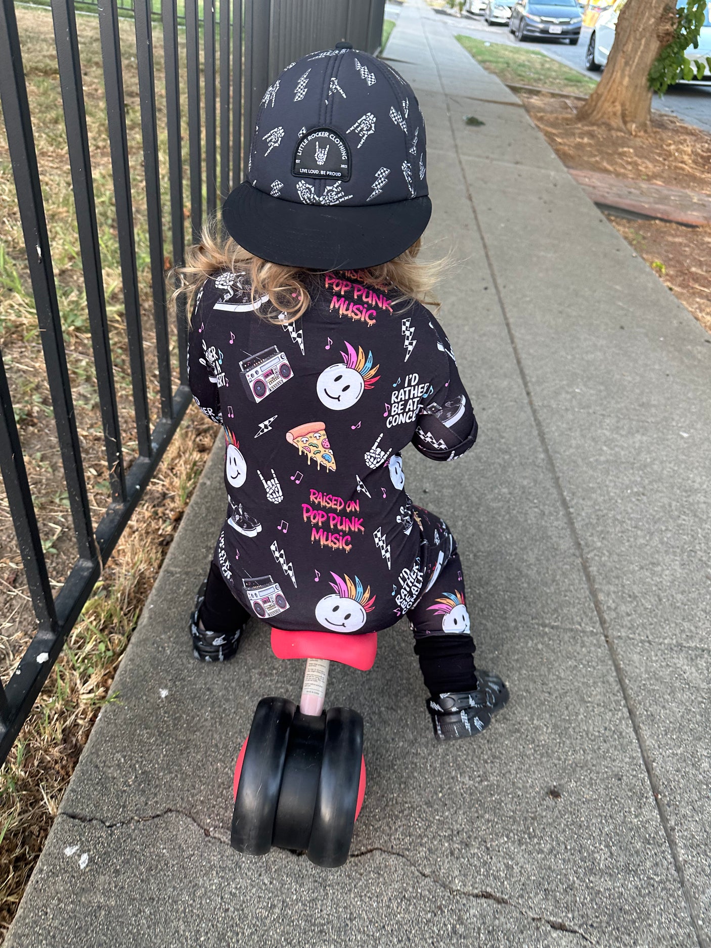 toddler playing in pop punk collage pattern long sleeve zip up bamboo pajamas for kids