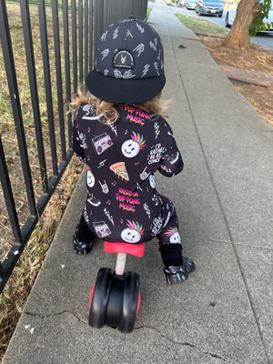 toddler playing in pop punk collage pattern long sleeve zip up bamboo pajamas for kids
