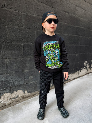 Young boy wearing Kids black Scene Sampler crew neck sweatshirt featuring pop punk, emo, and alt rock graphic with train illustration, rocker style kids apparel