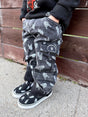 kids wearing black washed baggy jeans with skull pattern styled as edgy kids outfit from Little Rocker Clothing