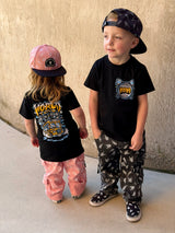 Little Rocker Clothing world tour shirt featuring tour bus graphic and rockstar design, rocker inspired kids graphic tee with soft comfortable fit, oversized style available in sizes 0-3 month to 10/12