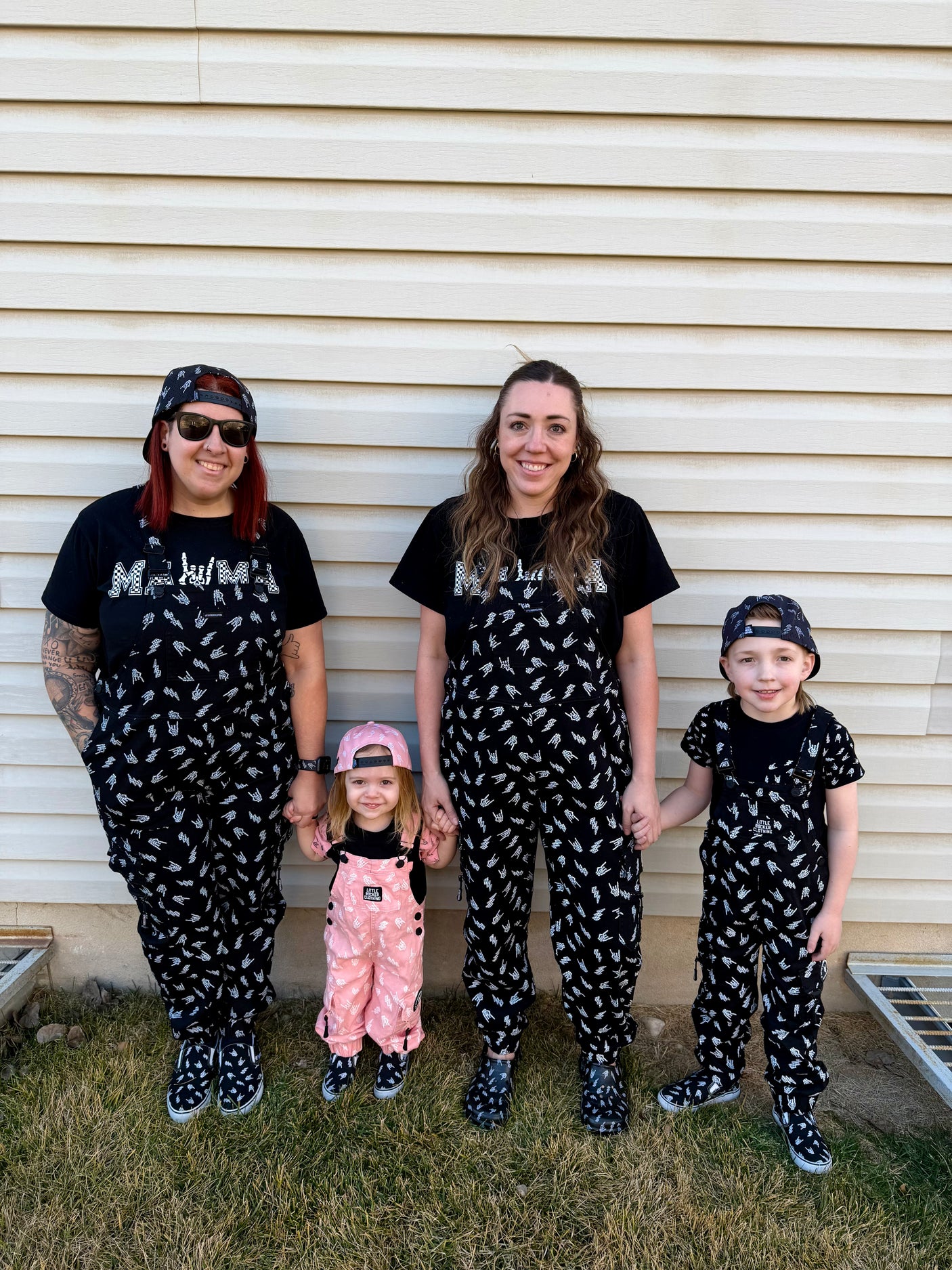 black bolted bones overalls for adults shown with matching kids outfit styled for edgy outfits and everyday wear