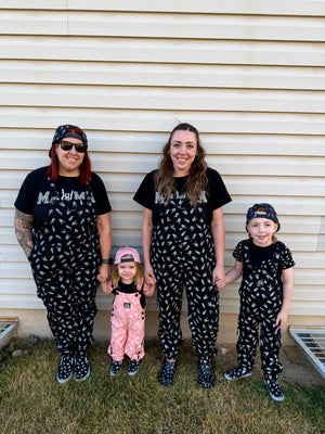black bolted bones overalls for adults shown with matching kids outfit styled for edgy outfits and everyday wear