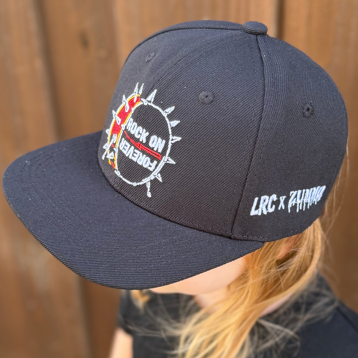 Frank Zummo collaboration with Little Rocker Clothing snapback hat with drum graphic and rock on forever phrase, edgy rock style kids hat with adjustable fit, music inspired youth apparel accessory