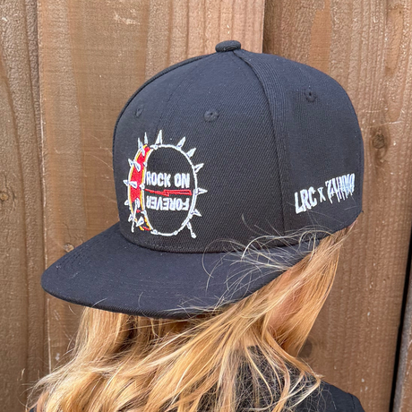 Kid wearing Frank Zummo collaboration with Little Rocker Clothing snapback hat with drum graphic and rock on forever phrase, edgy rock style kids hat with adjustable fit, music inspired youth apparel accessory