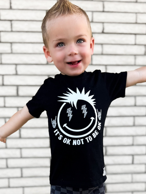 toddler boy wearing black kids graphic t-shirt with it's okay to not be okay, mental health awareness, little rocker clothing rock style outfit 
