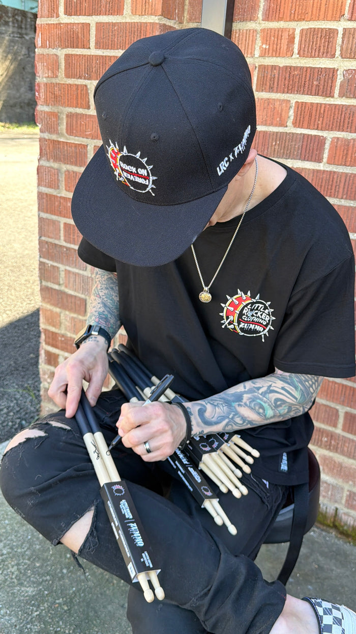 frank zummo and little rocker clothing autographing collab drum sticks