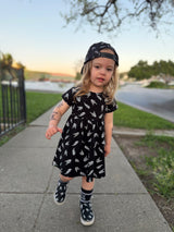 edgy toddler outfit with black skull print dress from Little Rocker Clothing alternative kids fashion and rock style clothing