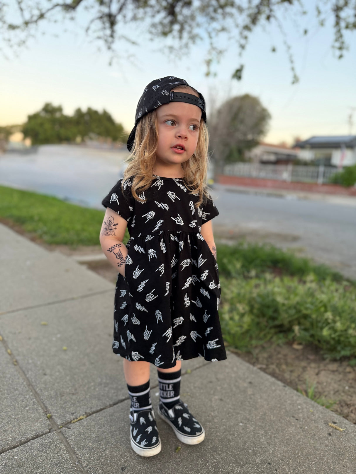 edgy toddler outfit with black skull print dress from Little Rocker Clothing alternative kids fashion and rock style clothing