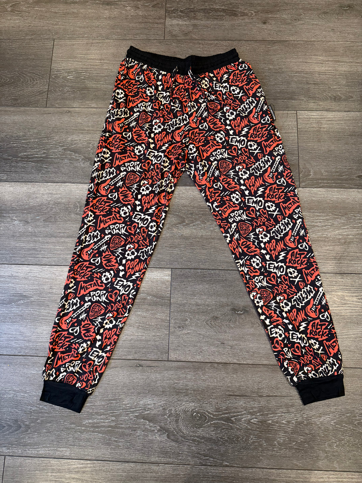 Adult size bamboo pajamas pant joggers with rock inspired red and black design. 